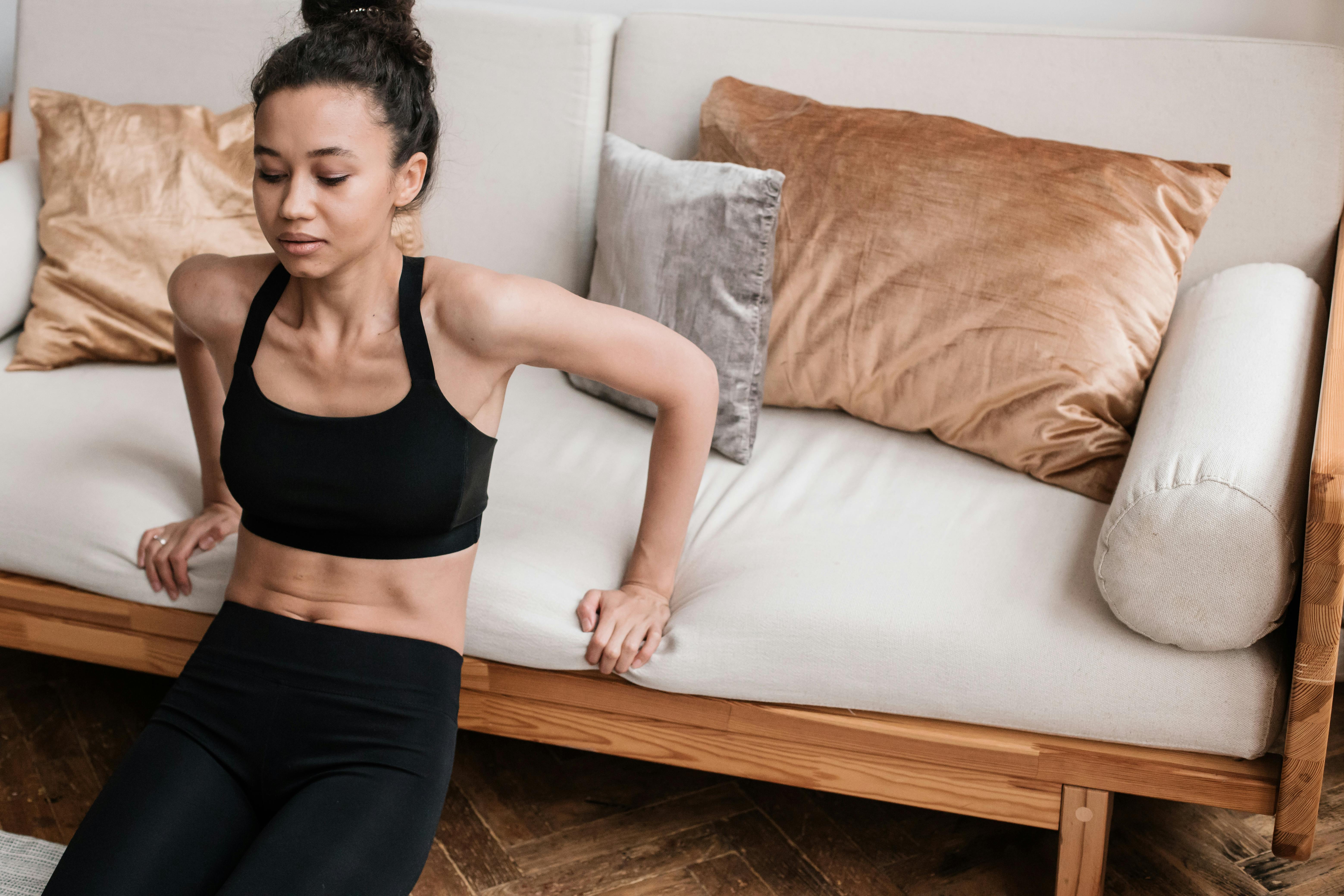 Young Woman in Black Sports Bra and Black Leggings Doing Home Workout ·  Free Stock Photo