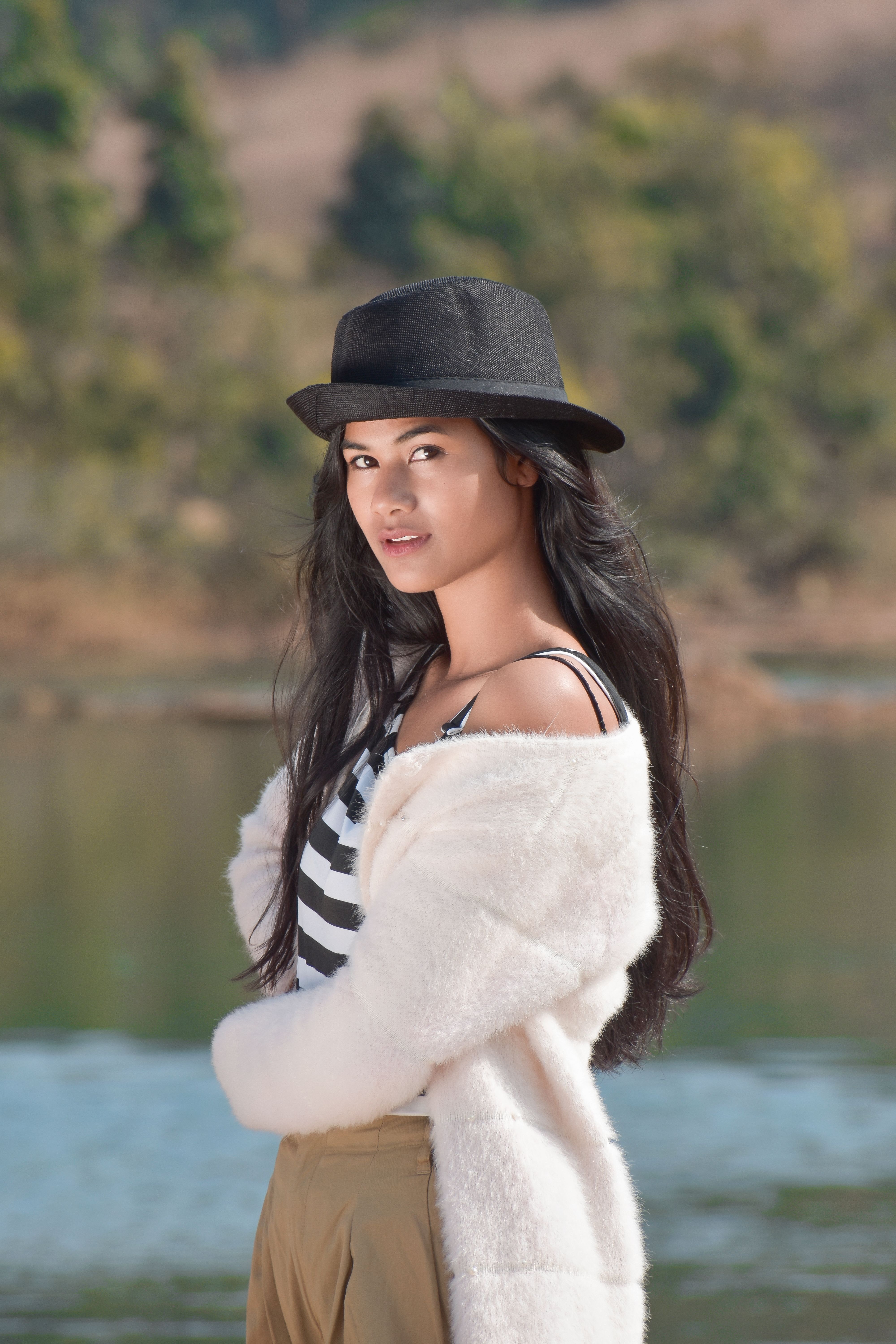 A Beautiful Woman in Red Dress Wearing a Hat · Free Stock Photo