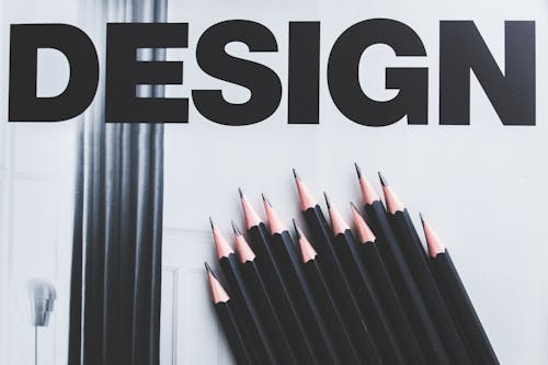 Black pencils and Design word