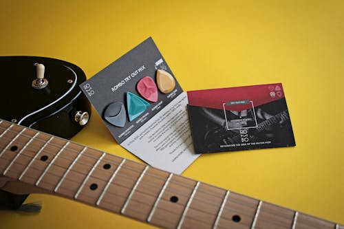 Free Electric Guitar on Yellow Surface
 Stock Photo
