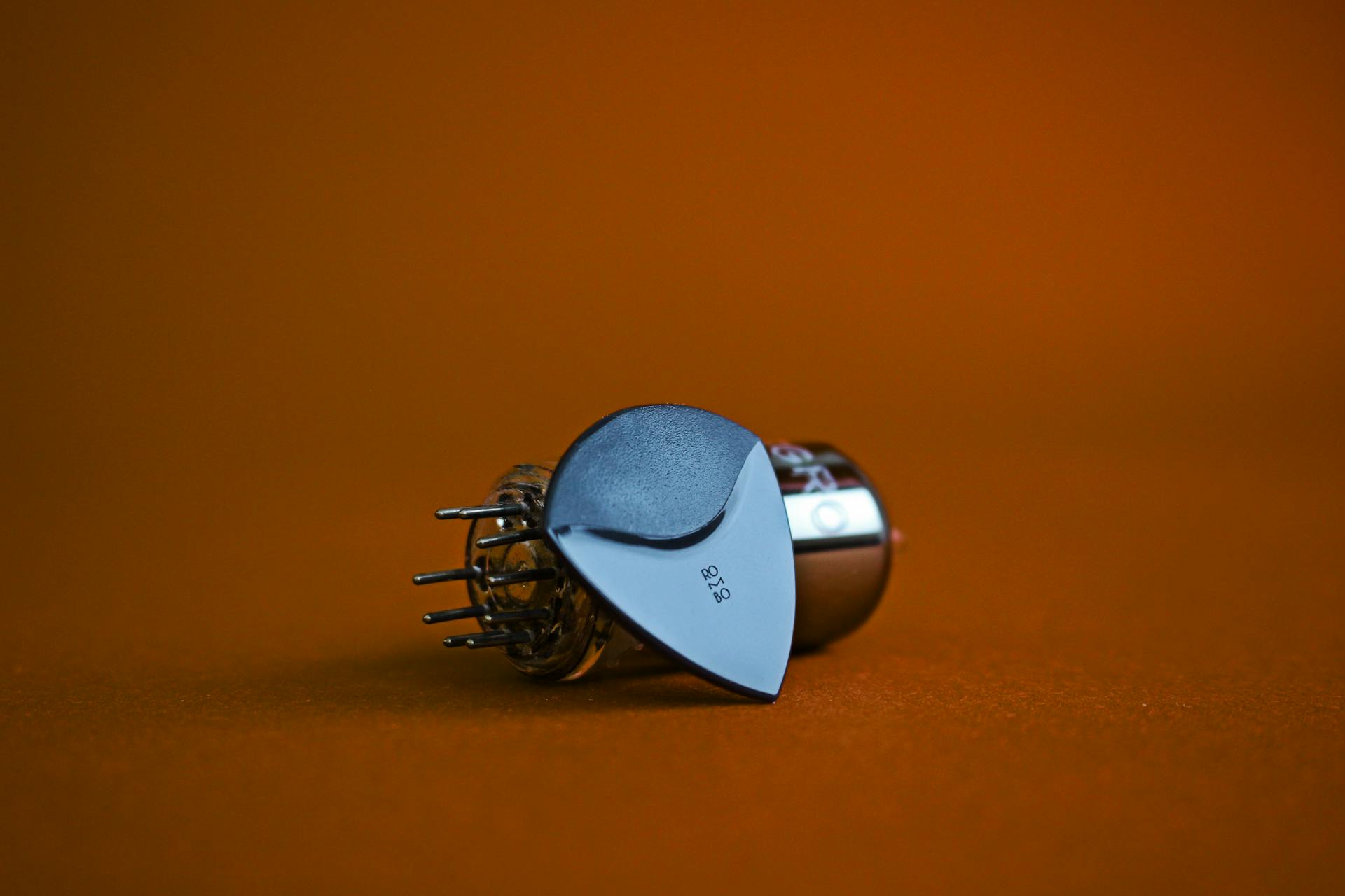 Close-Up Photo of Black Rombo Guitar Pick
