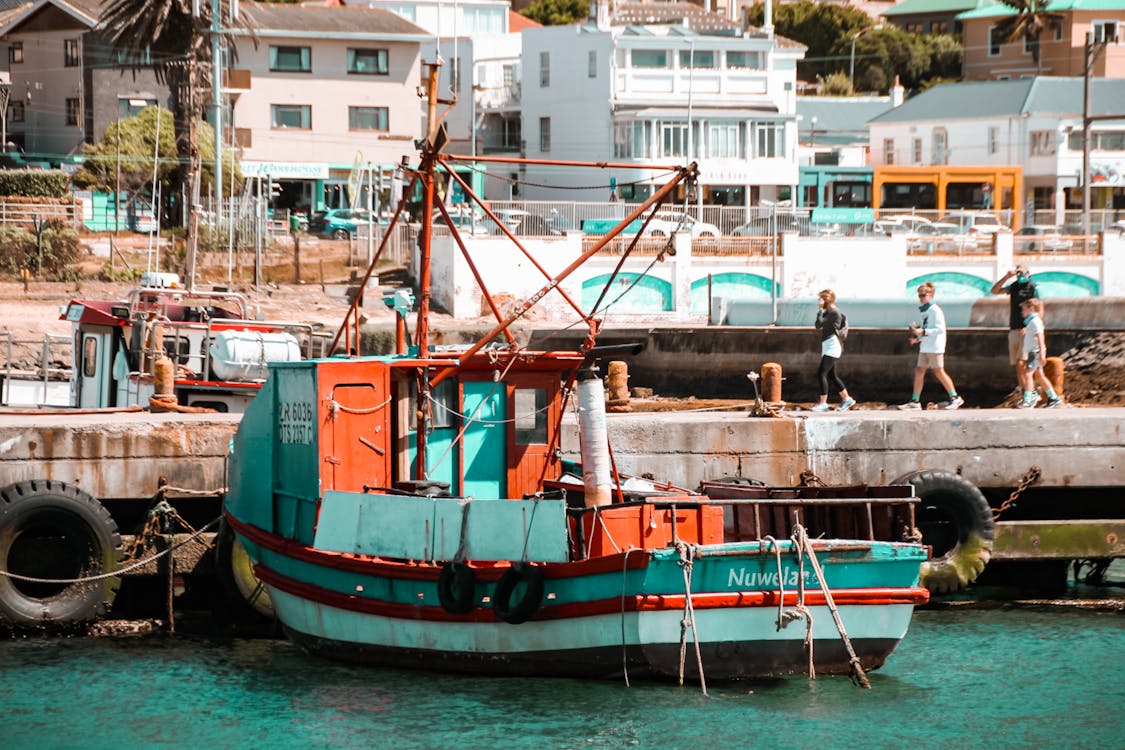 A Boat Docked at a Harbor