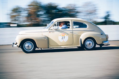 White Volkswagen Beetle on Road