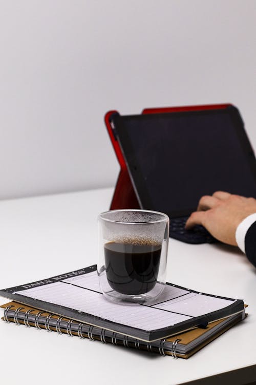 Free Coffee on a Daily Planner Stock Photo