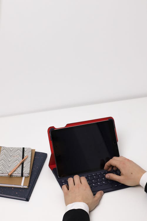 Close-Up Shot of a Person Using a Tablet Computer