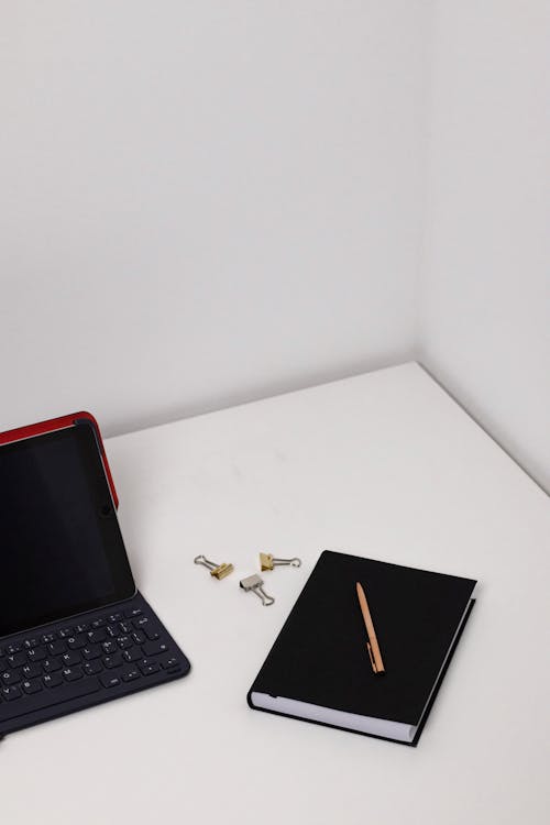 Free Laptop and Notebook on the Desk Stock Photo