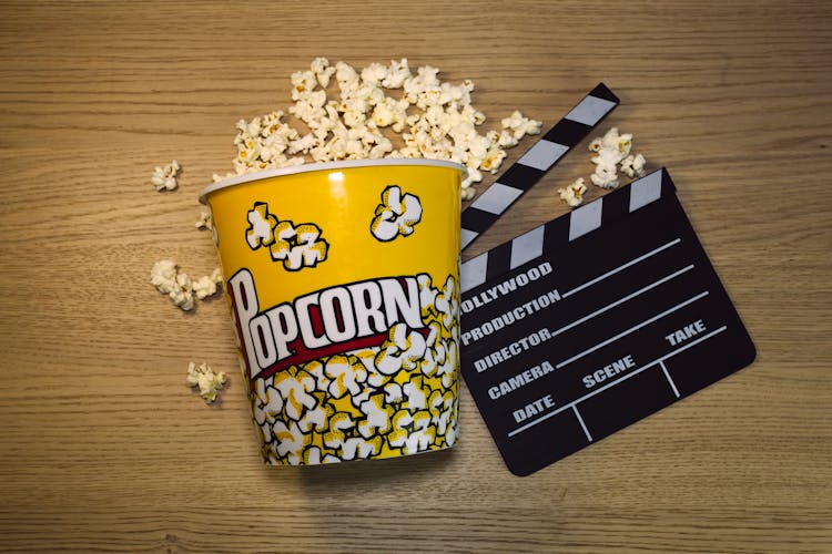 Overhead Shot Of A Bucket Of Popcorn And A Clapperboard