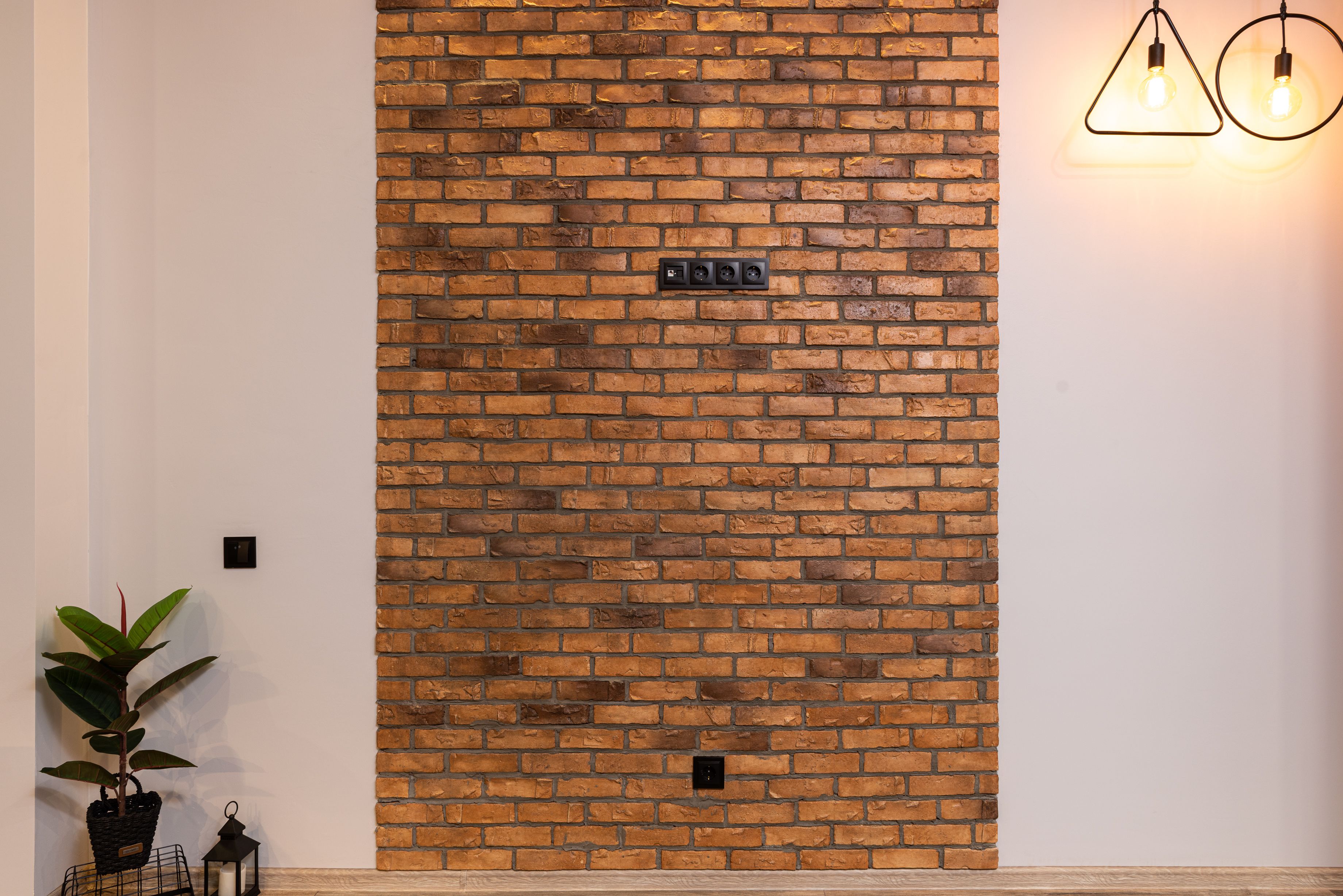 Picture of Interior of modern apartment with brick wall · Free Stock Photo