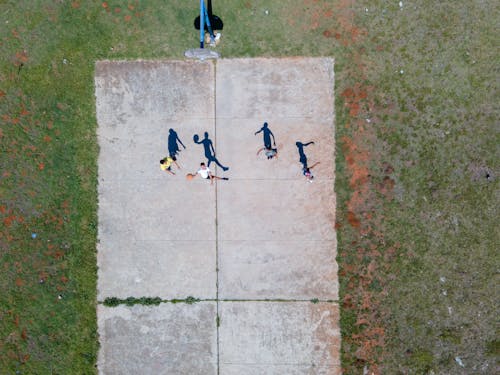 People Playing Basketball on Court