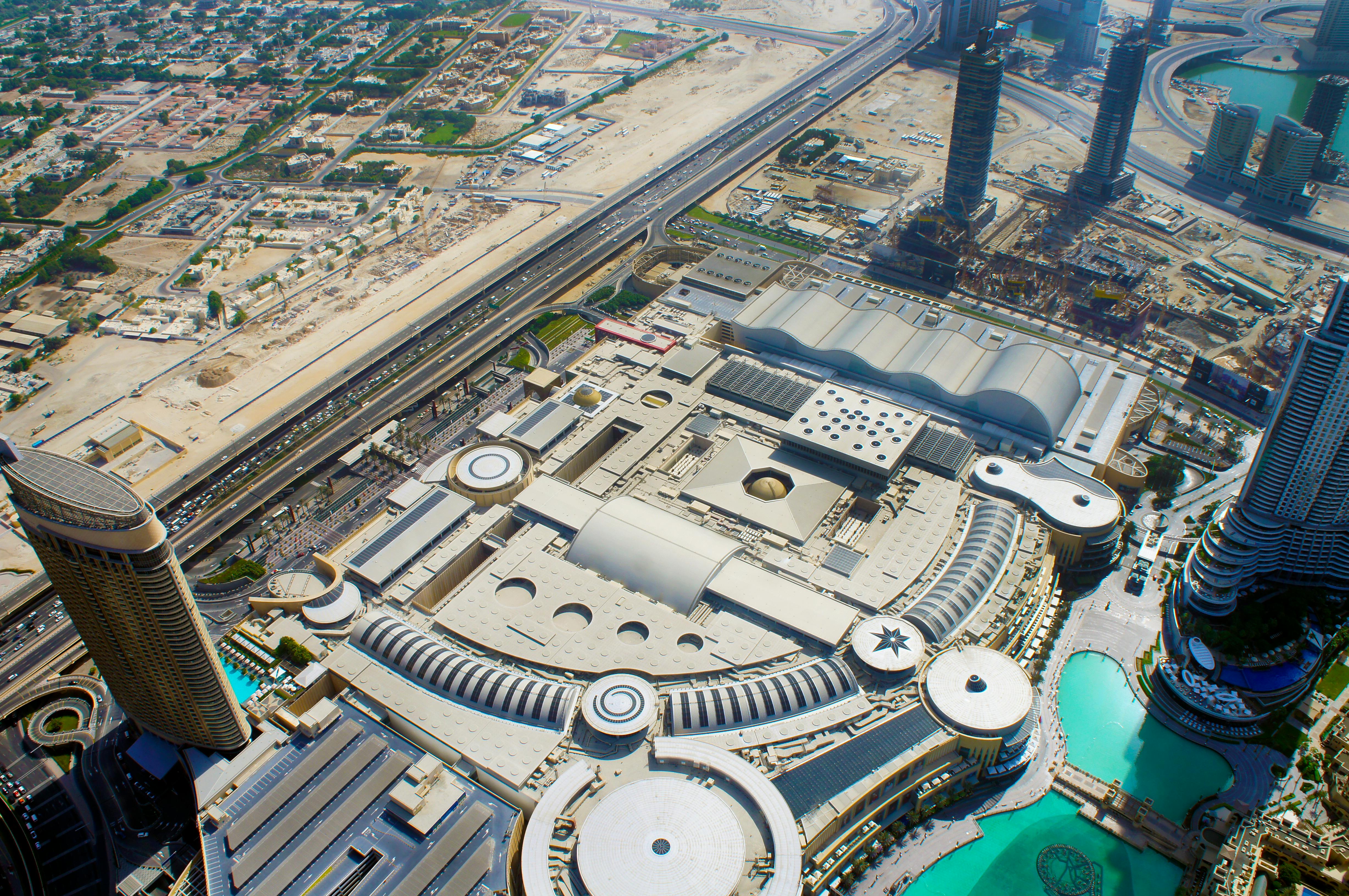 Stunning aerial shot of Dubai's urban landscape featuring iconic skyscrapers and architectural marvels.