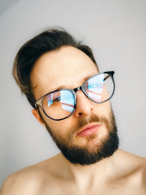 A Man Wearing Black Framed Eyeglasses