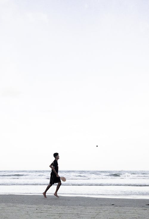 A Man Standing on Sea Shore