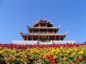 A Garden of Blooming Flowers in front of a Pagoda