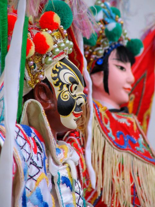Free Intricate traditional figurines with vibrant costumes and detailed features. Stock Photo