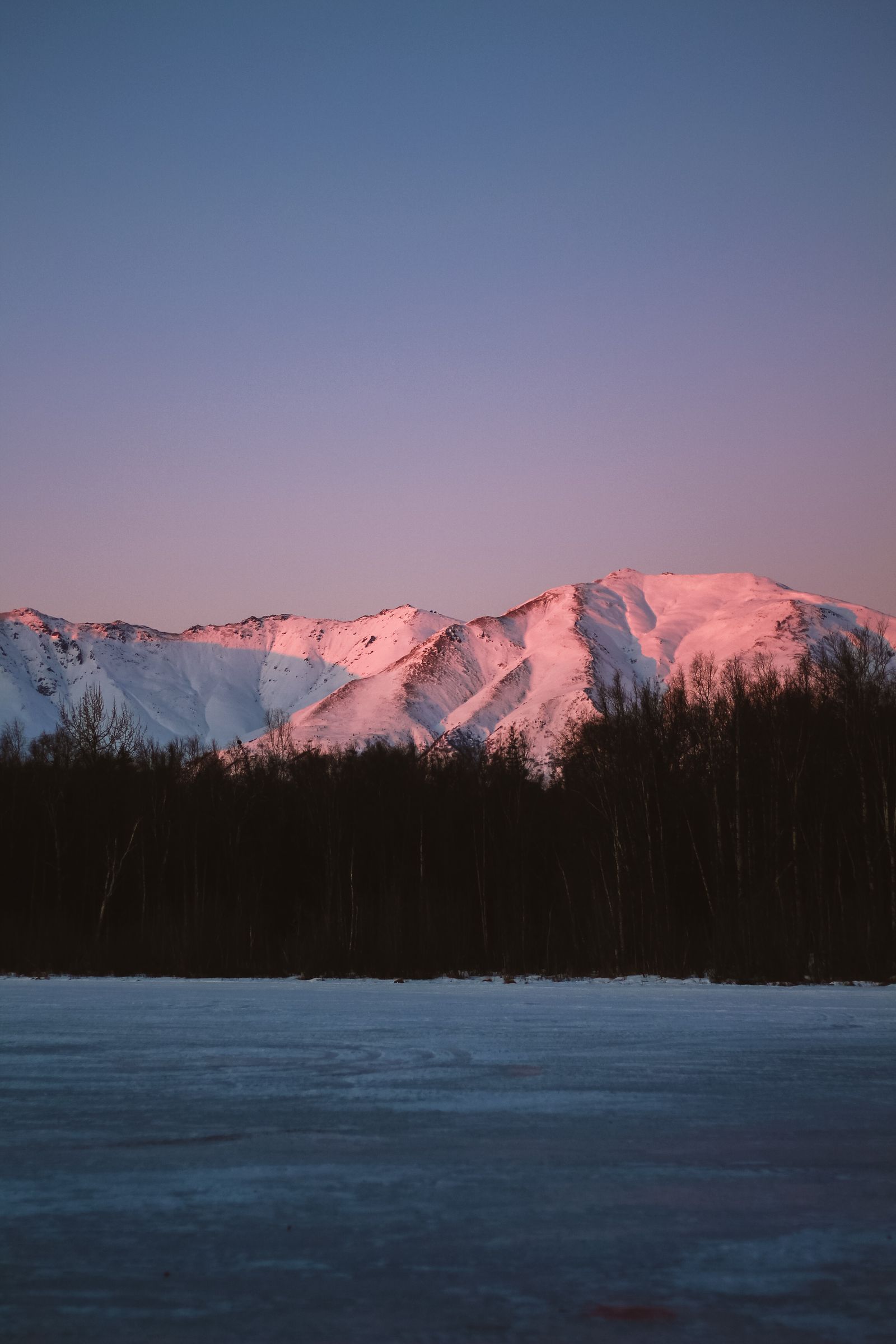 Alaska midnight sun over mountains