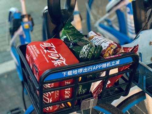 Coca Cola and Chips in Close-Up Photography