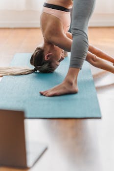 A woman performing yoga in a bright living room, emphasizing wellness and flexibility.