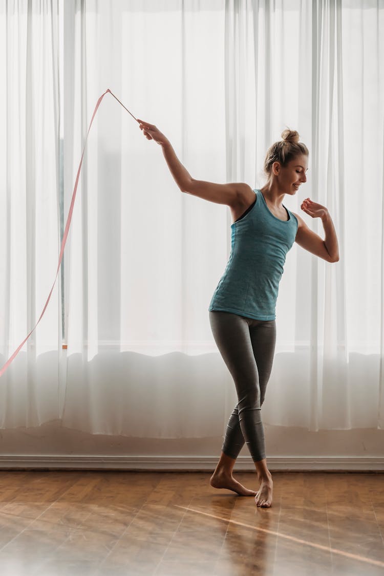 Graceful Woman Doing Exercises With Gymnastic Ribbon