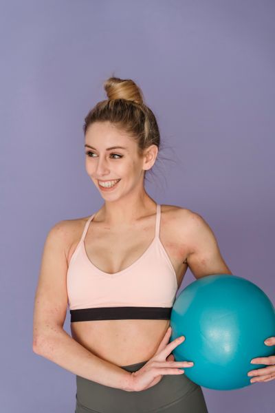 Coach holding an exercise ball — Marta Wave on Pexels