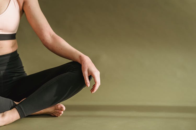 Young Woman Doing Yoga In Lotus Pose