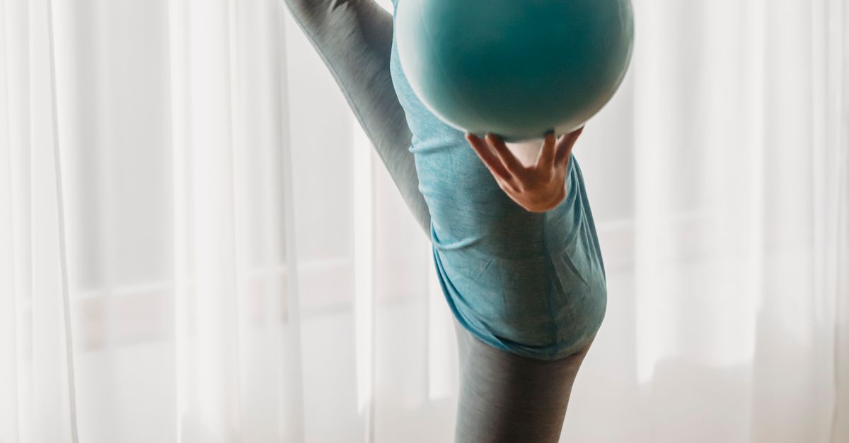 Practicing Balance Ball Fit woman practicing balance with ball · Free Stock Photo