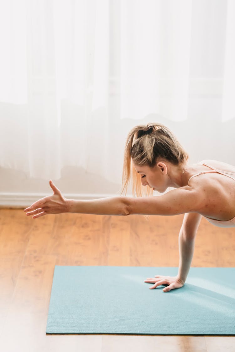 Woman Doing Yoga In Table Balancing Pose