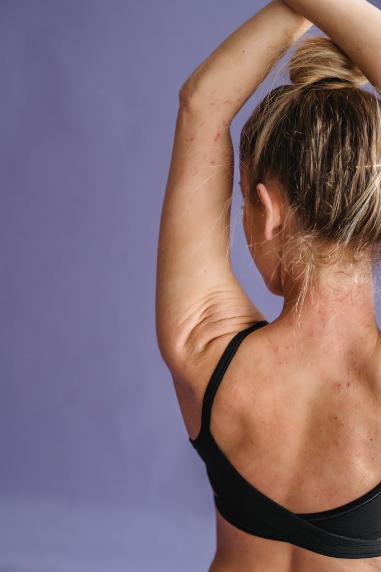 Woman In Sportswear Crossing Hands Above Head