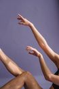 Woman raising hands gracefully in studio