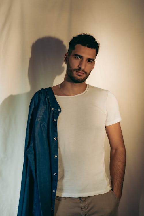 A Man in White Crew Neck T-shirt and Blue Denim Jacket