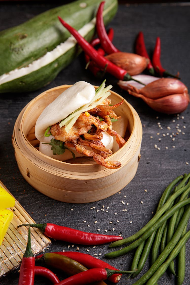 Bao With Fried Filling In A Bamboo Steamer