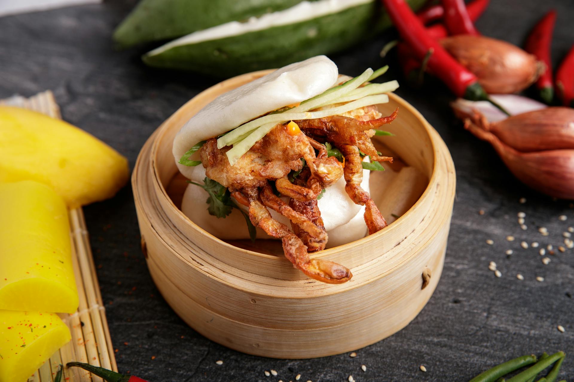 Cooked Food in a Bao Bun on a Bamboo Steamer