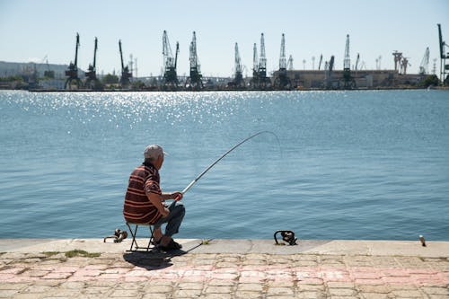 açık hava, Balık tutmak, balıkçı içeren Ücretsiz stok fotoğraf