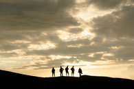Silhouette of People on Mountain