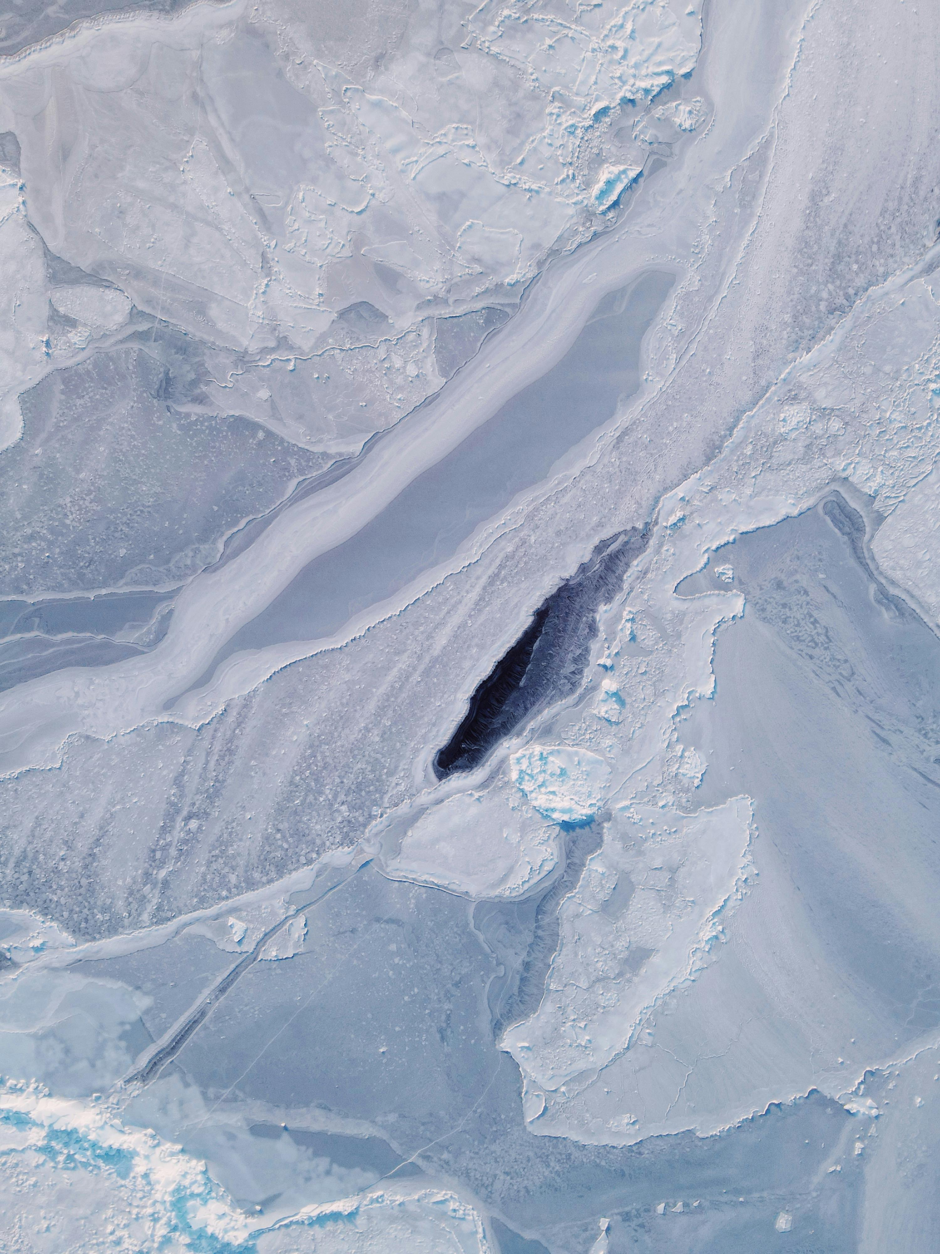 Aerial view of intricate ice formations on a frozen lake near Vladivostok, Russia.