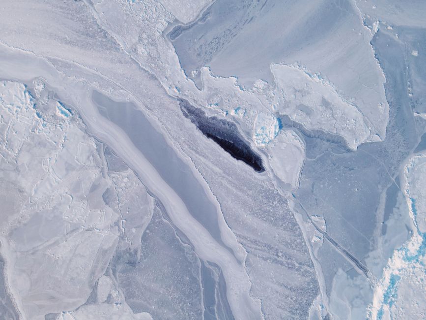 Stunning aerial view of ice formations resembling a glacier in winter.