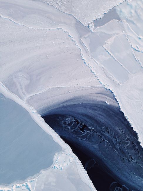 Stunning aerial image of ice formations showing a swirling design, captured in Vladivostok, Russia.
