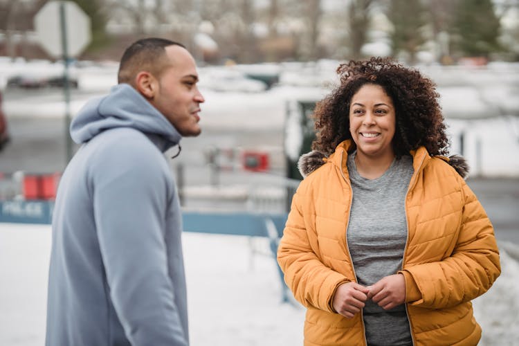 Happy Black Couple In Sportswear On Winter Street