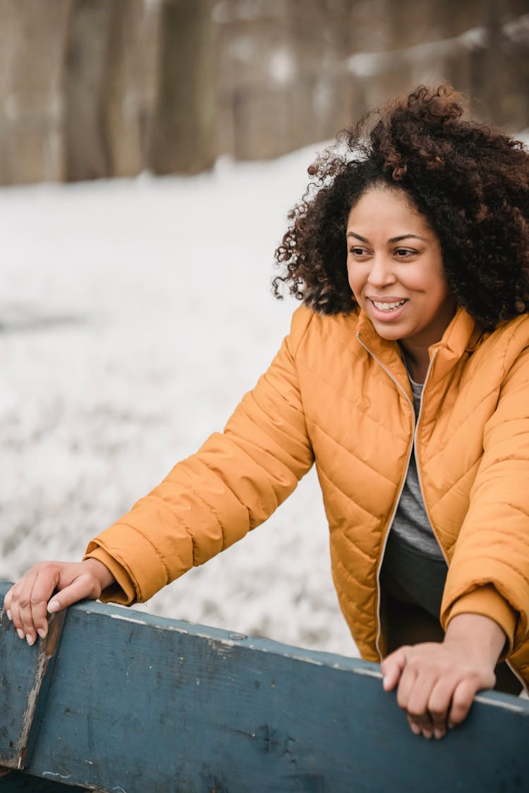 Happy Black Woman Warming Up In Winter Park