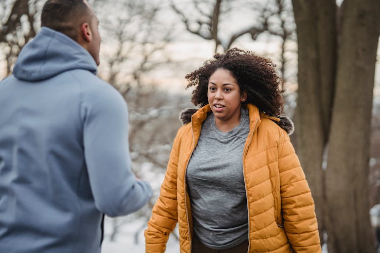 Black Couple In Winter Park During Training