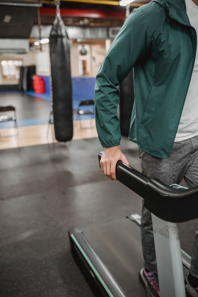 Man Training On Treadmill In Gym