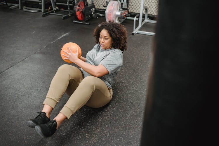 Black Woman With Ball Pumping Press