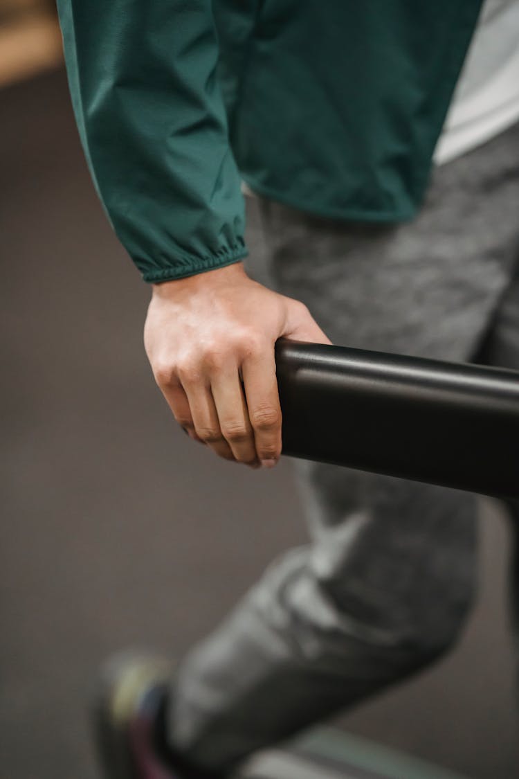 Man Walking On Treadmill Of Gym