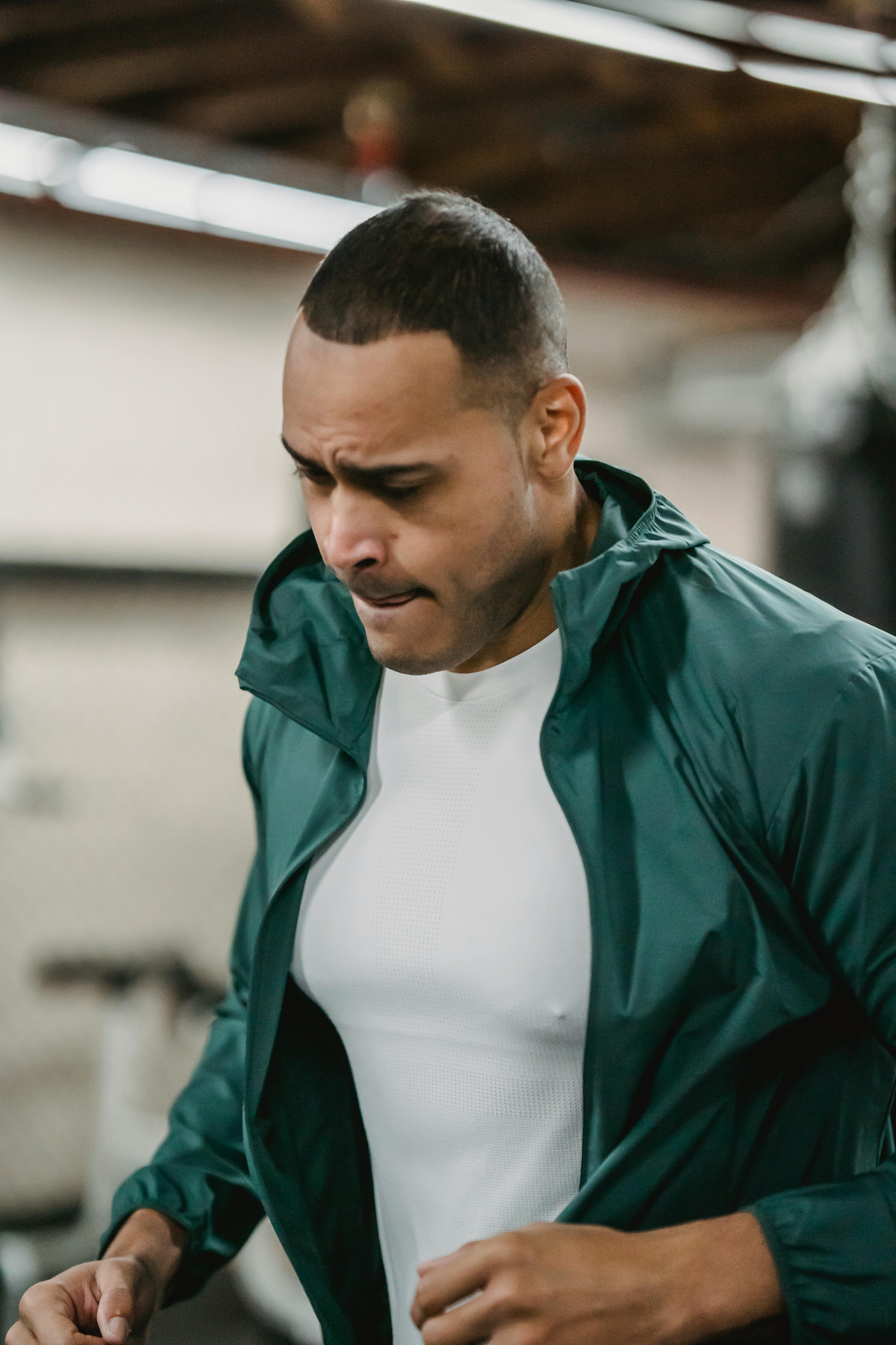 focused strong man running in gym