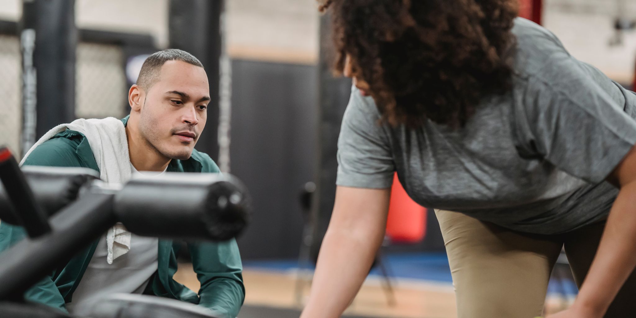 Personal trainer coaching a client