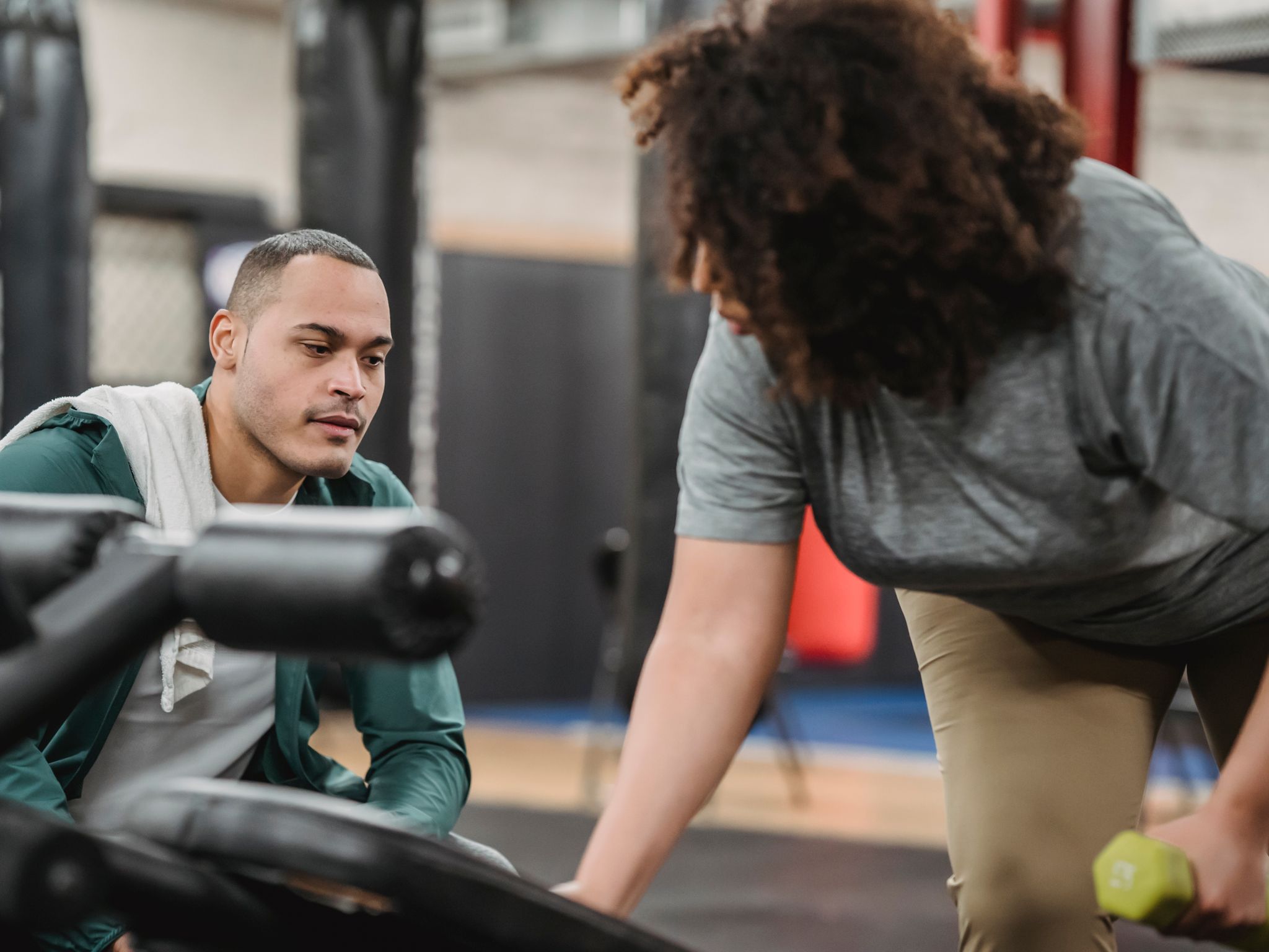 Personal trainer coaching a client
