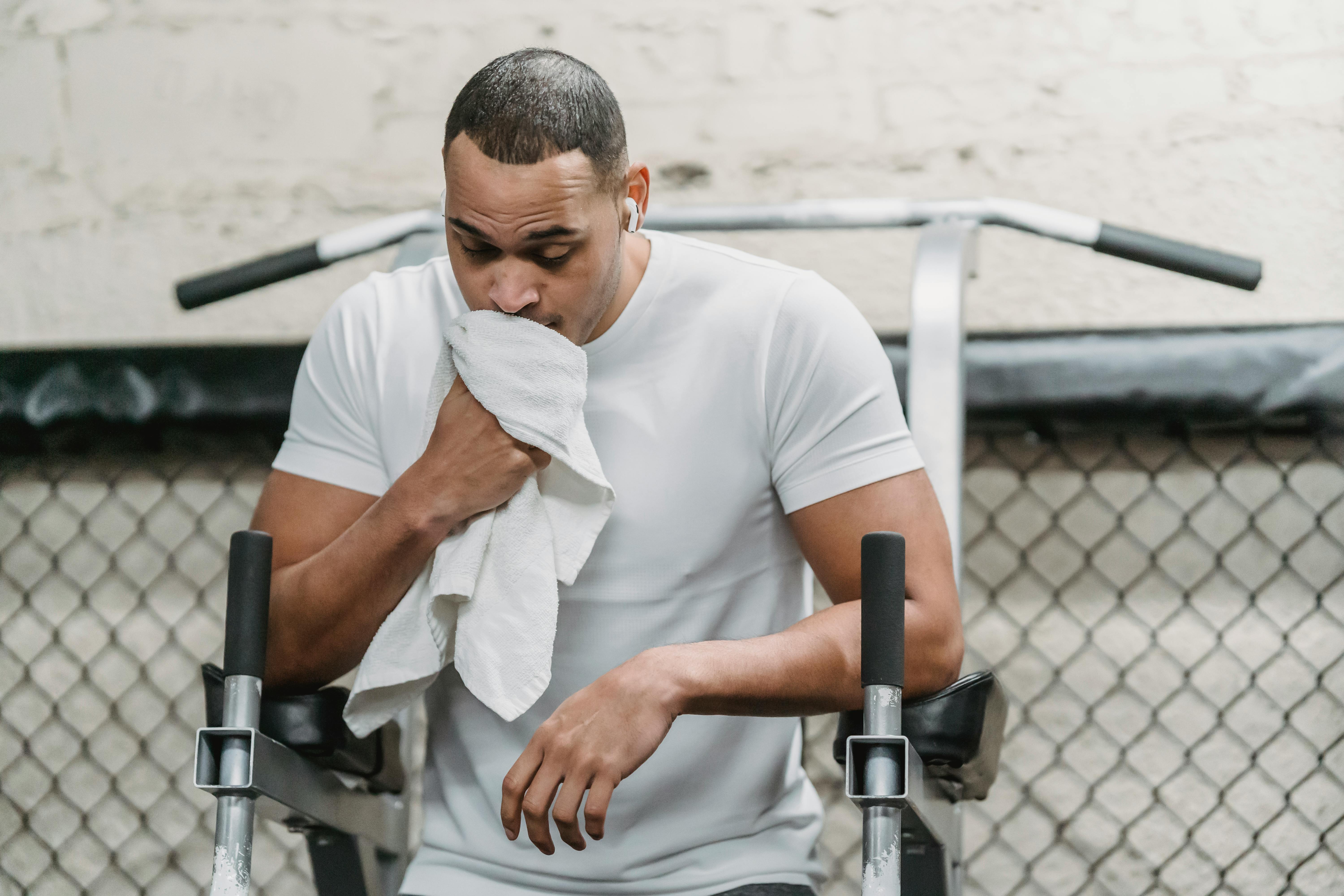 black sportsman resting after intense workout