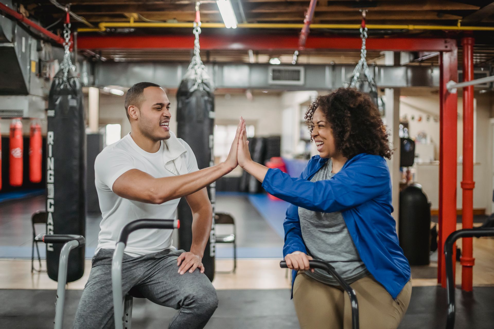 Athletic Black and white pair training together in a gym