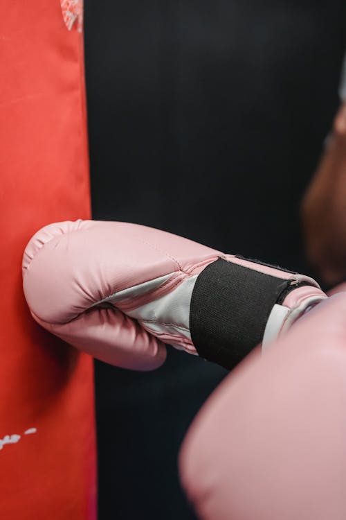 Free Boxer in boxing glove during training in gym Stock Photo