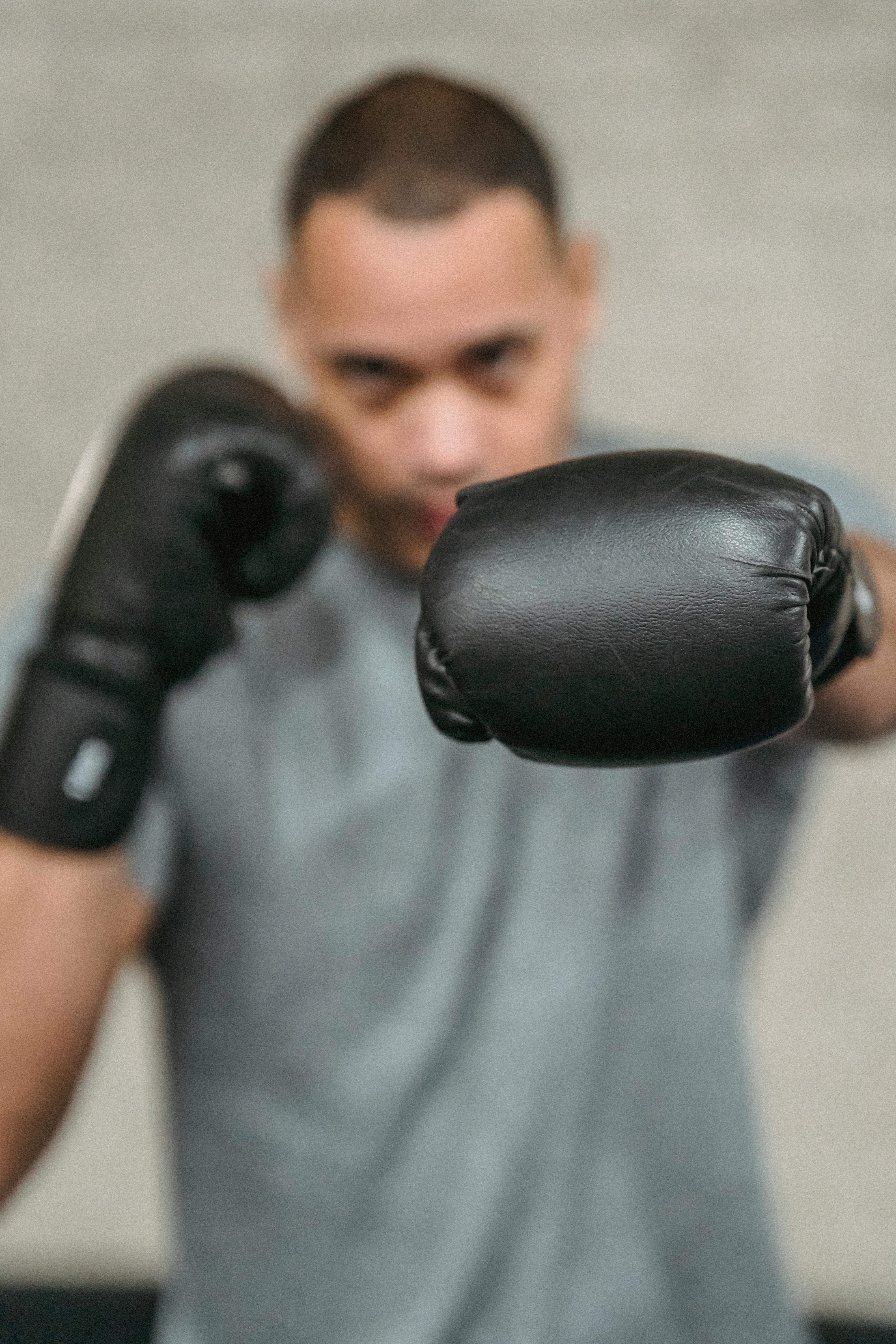 strong ethnic fighter showing punching technique during training