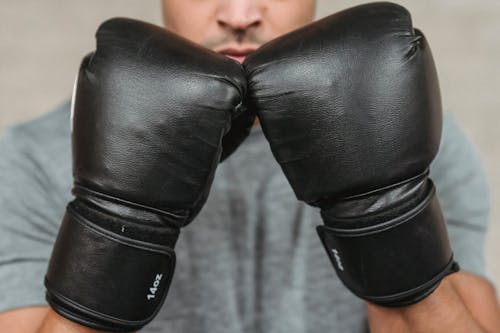 Free Anonymous male boxer standing in defensive pose Stock Photo